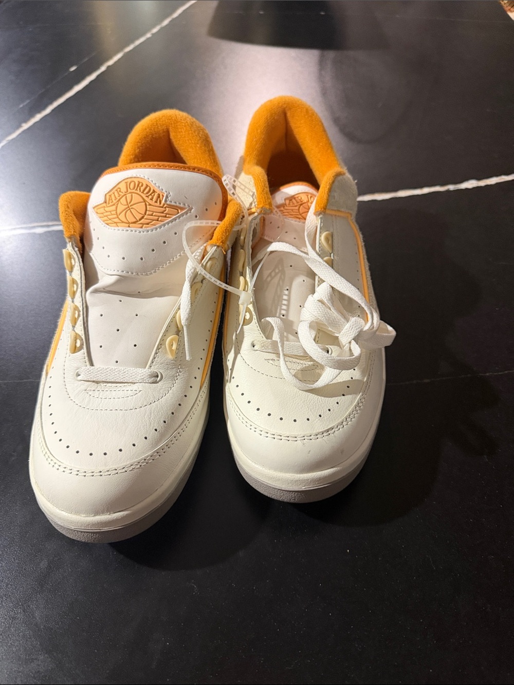Jordan White and Orange Low-Top Sneakers with Gold Logo Accent